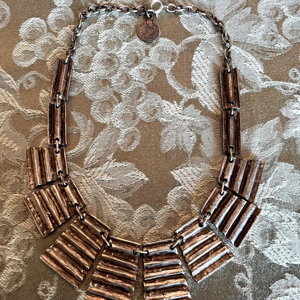 Silver Statement Necklace with Graduated Beads and Curved Design